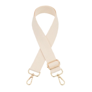 Macro detail of beige thickened canvas bag strap with golden metal swivel hooks