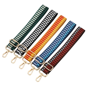 Adjustable woven guitar style shoulder straps with geometric patterns and gold hooks