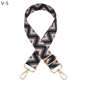 Adjustable zigzag pattern bag strap with gold metal buckles and grey weave detail