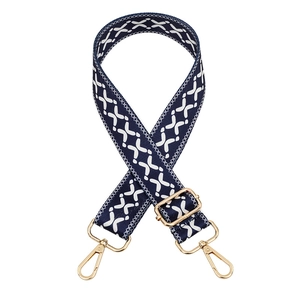 Adjustable dark blue bag strap with white geometric patterns and gold metal hooks