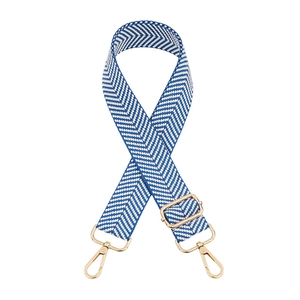 Adjustable wide blue and white herringbone pattern bag strap with gold metal hardware