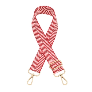 Close-up of red and white chevron woven strap with adjustable golden metal hardware