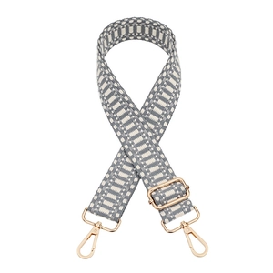 Adjustable geometric woven bag strap in grey and white with gold lobster clasps