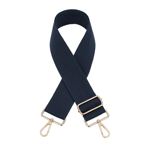 Detail view of navy blue fabric strap with adjustable gold metal buckle and hooks