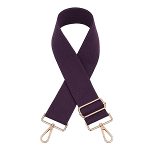 Close-up of deep purple adjustable canvas strap with shiny gold swivel hooks