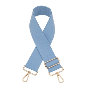 Close-up of light blue nylon wide bag strap with pale gold metal lobster clasps and buckle