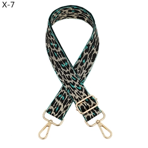 Close-up of adjustable leopard print bag strap with high-quality gold metal lobster hooks