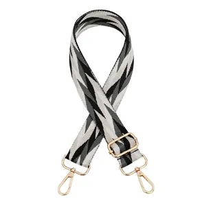 Adjustable woven shoulder strap for bags with black and white geometric zigzag pattern