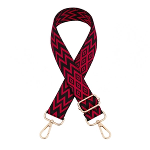 Adjustable red and black geometric woven shoulder strap with gold metal buckles