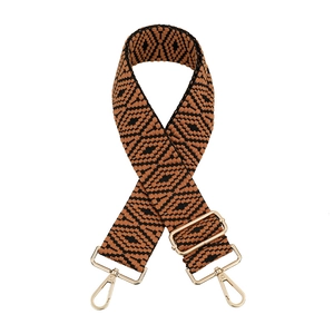 Close-up of adjustable woven shoulder strap with retro geometric pattern and gold clips