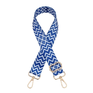 Adjustable royal blue and white geometric woven shoulder strap with gold metal lobster clasps
