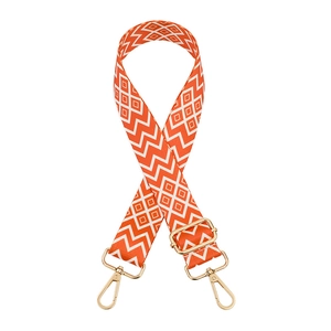 Adjustable wide shoulder strap with orange and white geometric pattern and gold hooks