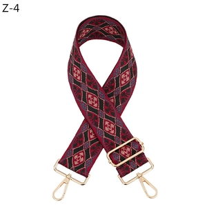 Macro view of geometric diamond pattern on thick woven adjustable bag strap
