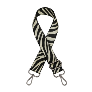 Detail of adjustable zebra pattern woven shoulder strap with dark silver metal swivel hooks
