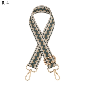 Adjustable wide shoulder strap with green and tan geometric patterns and gold metal clips