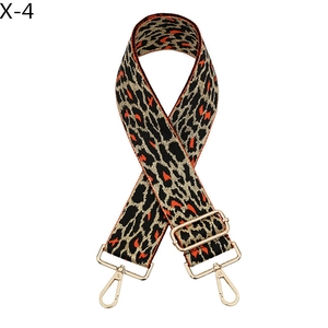 Macro shot of adjustable leopard print bag strap with high-quality gold lobster clasps