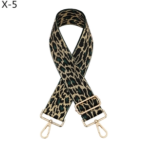 Detail of adjustable leopard print bag strap with golden metal lobster clasps