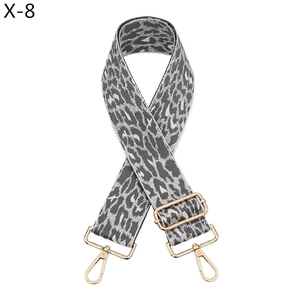 Detail of adjustable leopard print bag strap with golden metal swivel lobster clasps