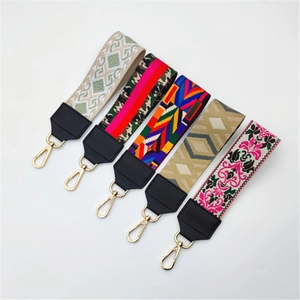 Five assorted stylish patterned shoulder straps for handbags with gold metal lobster clasps
