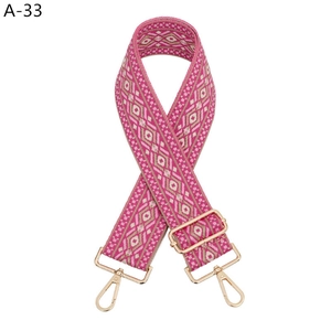 Ethnic style pink geometric woven bag strap with adjustable gold metal hardware