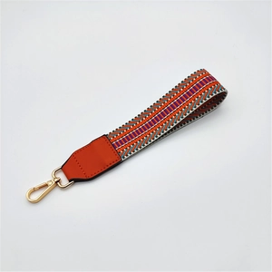 Colorful woven handbag strap with geometric pattern and gold swivel lobster clasp