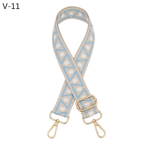 Adjustable canvas bag strap with blue geometric patterns and gold metal lobster clasps