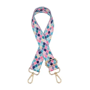 Close-up of Style 10 colorful clover patterned wide fabric shoulder strap with gold hardware