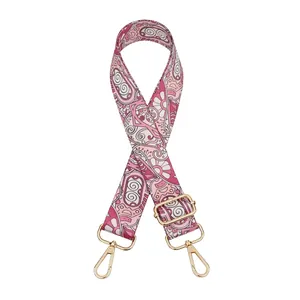 Adjustable paisley patterned fabric bag strap with gold metal lobster clasps and buckles
