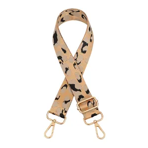 Adjustable leopard print bag strap with golden metal buckles and durable hardware