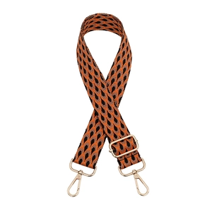 Adjustable woven shoulder strap with orange and black geometric pattern and gold buckles