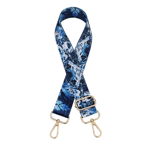 Adjustable crossbody bag strap with blue marble pattern print and gold hardware