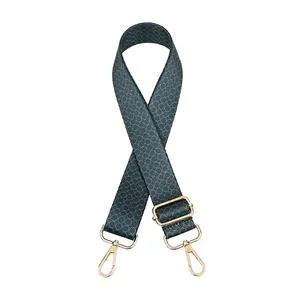 Adjustable teal blue bag strap with geometric pattern and pale gold metal lobster clasps