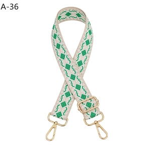 Detail of adjustable geometric diamond strap with gold metal buckles and lobster clips