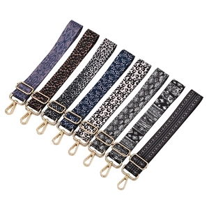 Adjustable crossbody bag straps with vintage patterns and gold metal swivel hooks