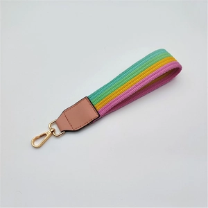 Rainbow striped woven wristlet strap with pink leather trim and gold lobster clasp