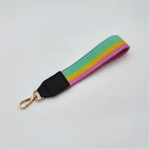 Colorful striped braided wrist strap with gold lobster clasp and faux leather detail