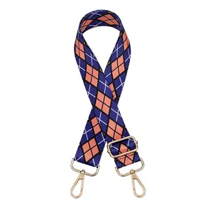 Detail showing blue and orange argyle fabric strap with golden metal swivel hooks