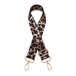Close-up of adjustable leopard print bag strap with golden zinc alloy metal buckles