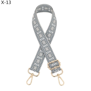 Detail of adjustable bohemian blue and white diamond pattern wide woven shoulder strap