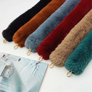 Detailed close-up of faux fur bag straps in six colors with gold lobster claw clasps