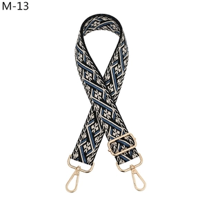 Ethnic jacquard woven strap with blue geometric patterns and gold metal lobster clasps