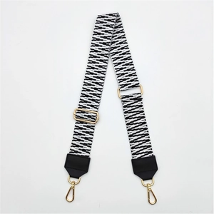 Close-up of adjustable PU leather bag strap with black and white geometric wave patterns