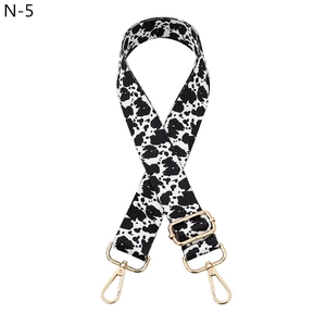 Adjustable cow pattern bag strap with durable fabric and gold metal lobster clasps