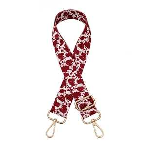Adjustable red cow print wide shoulder strap with gold metal hooks for crossbody bags