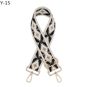 Close-up of bohemian geometric patterned bag strap with golden zinc alloy metal buckles