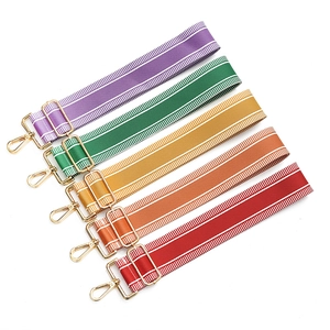 Adjustable striped crossbody bag straps with gold metal hardware in various candy colors