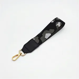 Close-up of leopard pattern handbag strap No.10 with golden metal lobster clasps