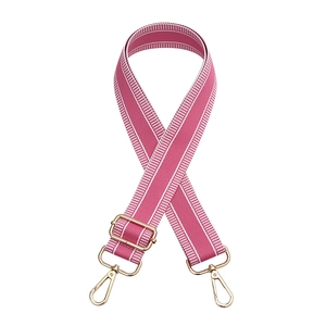 Adjustable pink candy-colored woven bag strap with golden hooks and white side stripes