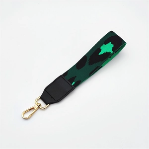 Fashionable green leopard print handbag strap with golden lobster clasp and leather trim