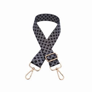 Adjustable crossbody shoulder strap with black and white floral pattern and gold hooks